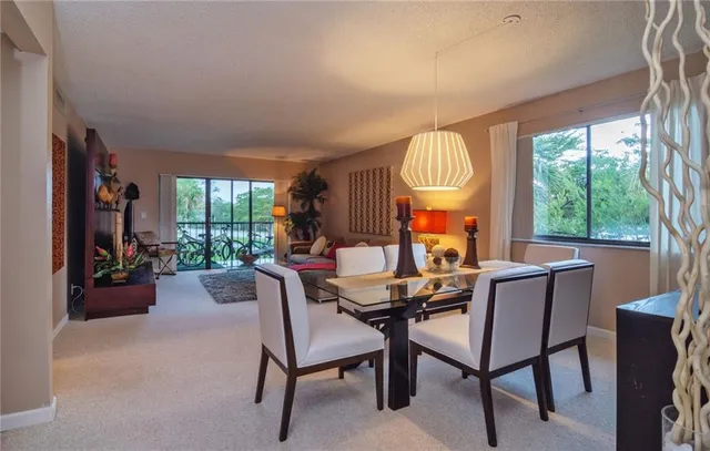 a dining room with furniture and window