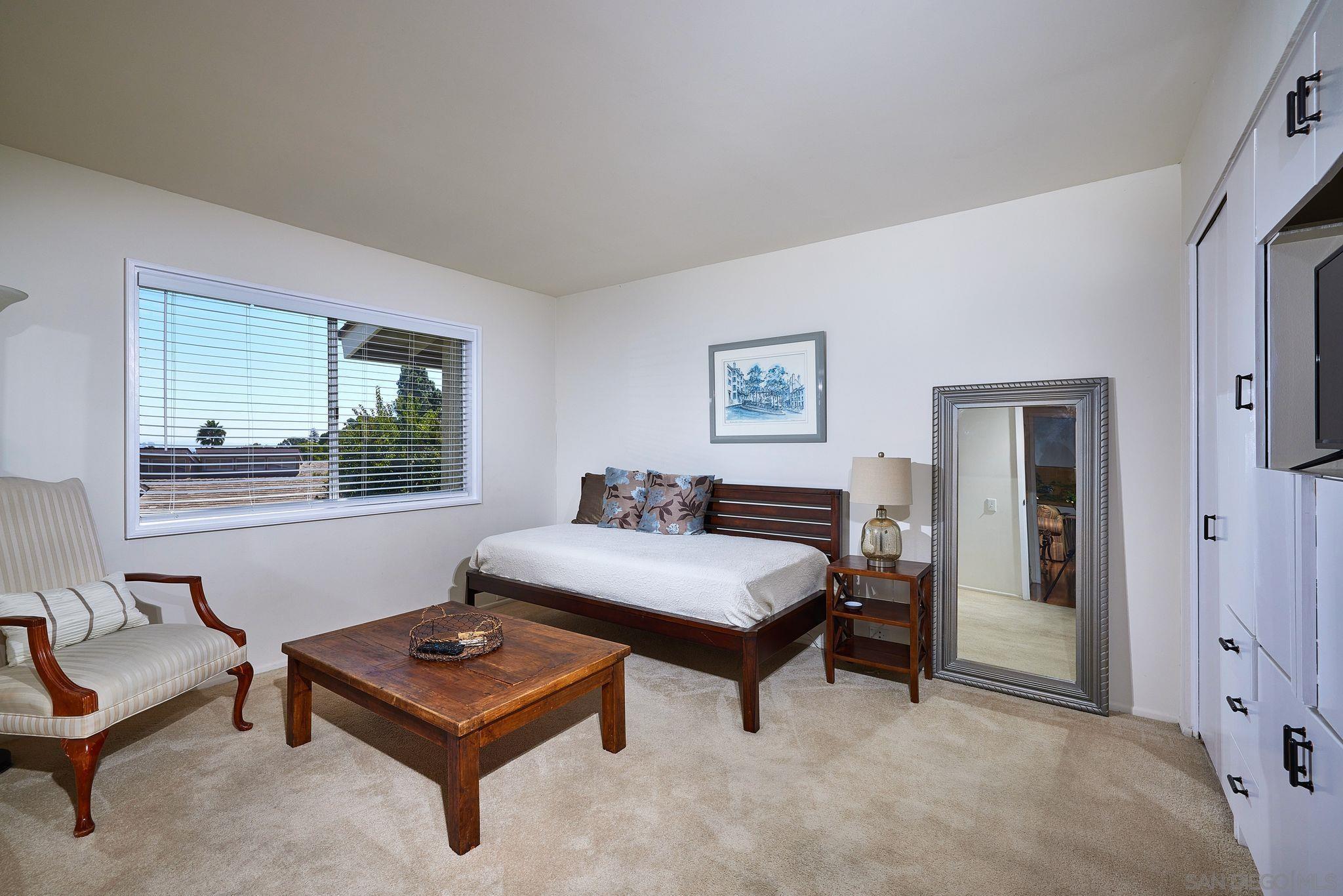2035 Caminito Circulo Sur La Jolla, CA 92037 - Photo 13 of 22 a living room with furniture and a window