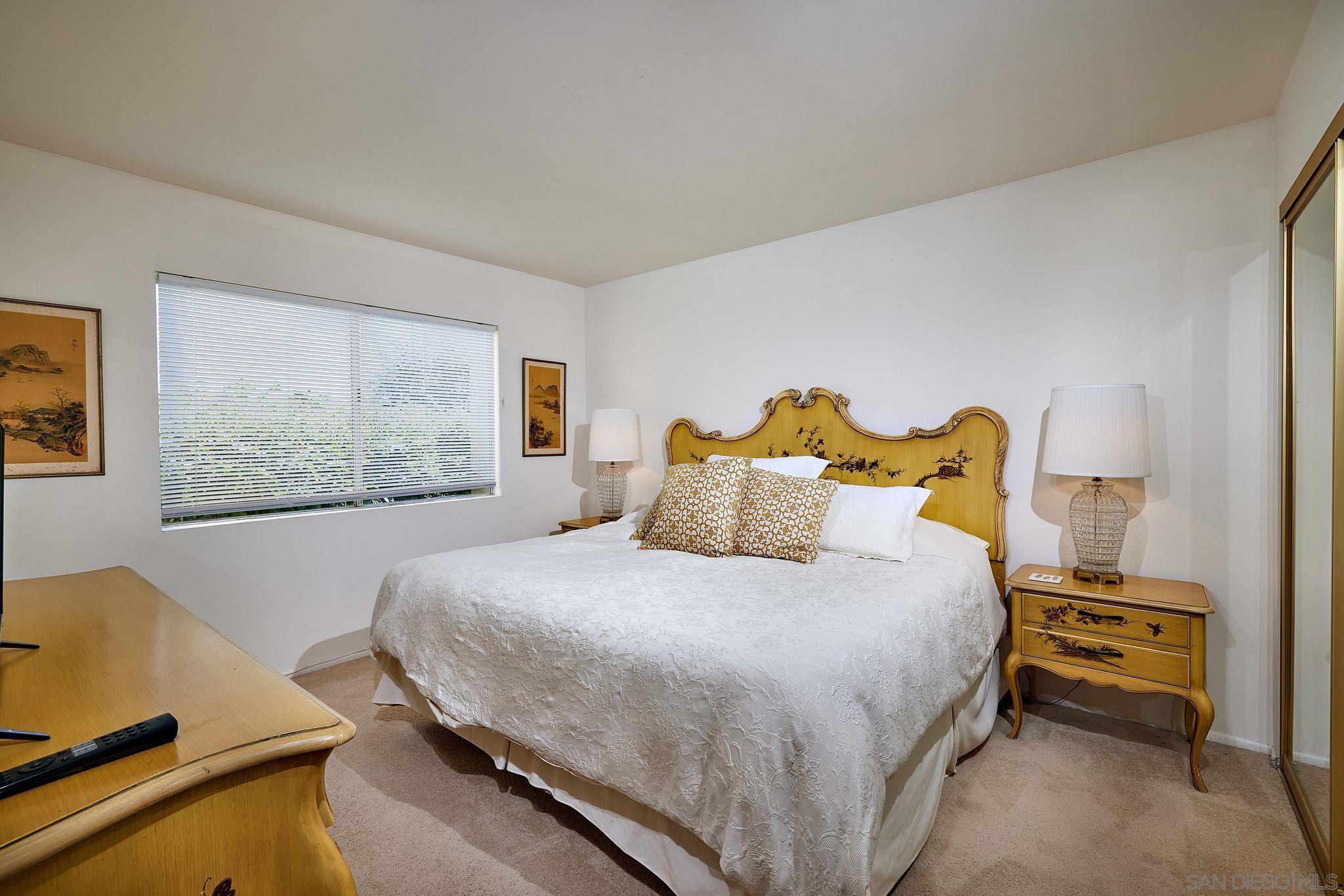 2035 Caminito Circulo Sur La Jolla, CA 92037 - Photo 15 of 22 a bedroom with a bed and a window