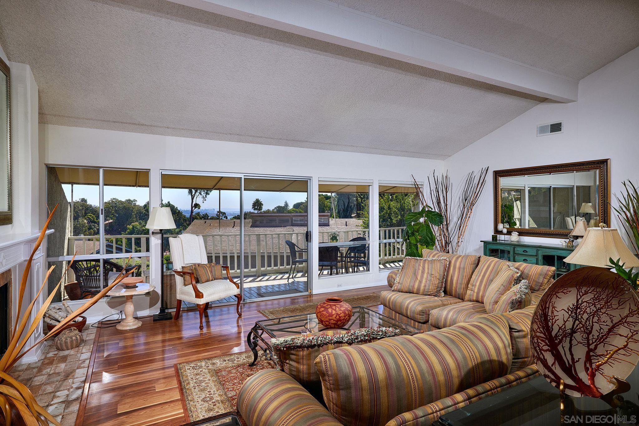 2035 Caminito Circulo Sur La Jolla, CA 92037 - Photo 2 of 22 a living room with furniture and a large window