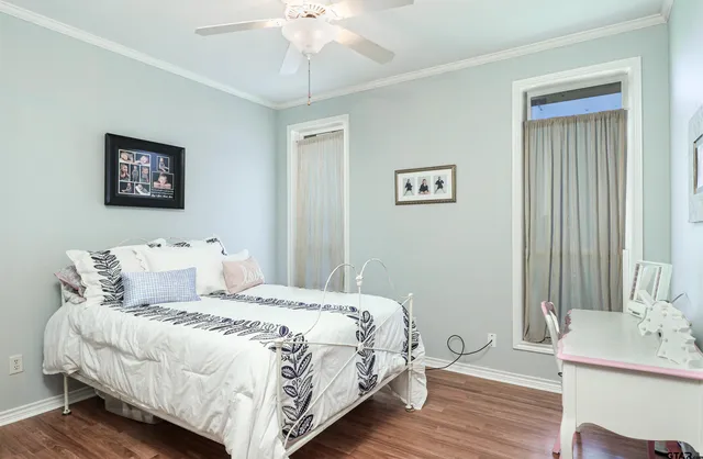 a bedroom with a bed and a table