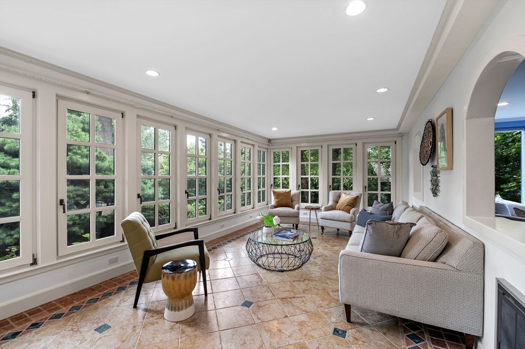18 Hemlock Road Cambridge, MA 02138 - Photo 13 of 26 a living room with furniture and a large window