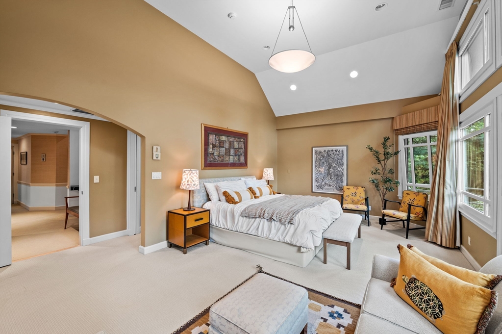 18 Hemlock Road Cambridge, MA 02138 - Photo 17 of 26 a bedroom with furniture and a chandelier