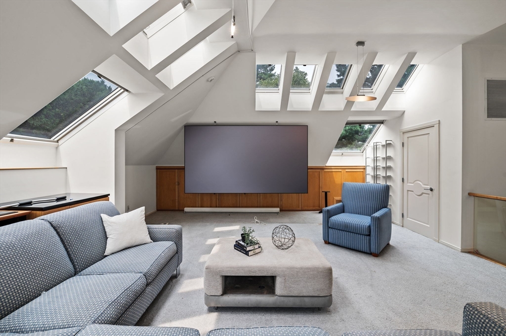 18 Hemlock Road Cambridge, MA 02138 - Photo 25 of 26 a living room with furniture and a chandelier