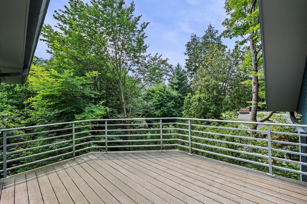18 Hemlock Road Cambridge, MA 02138 - Photo 10 of 26 a view of a balcony with wooden floor