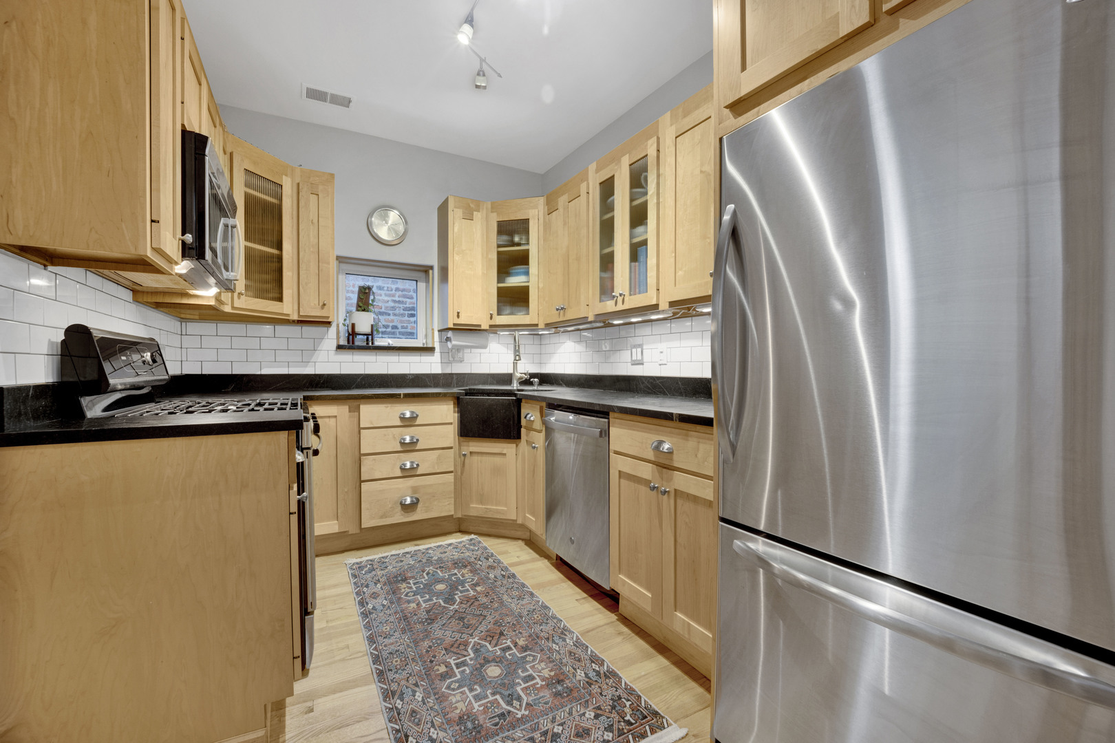 839 South Laflin Street, Unit 3 Chicago, IL 60607 - Photo 11 of 21 a kitchen with stainless steel appliances a refrigerator sink and microwave