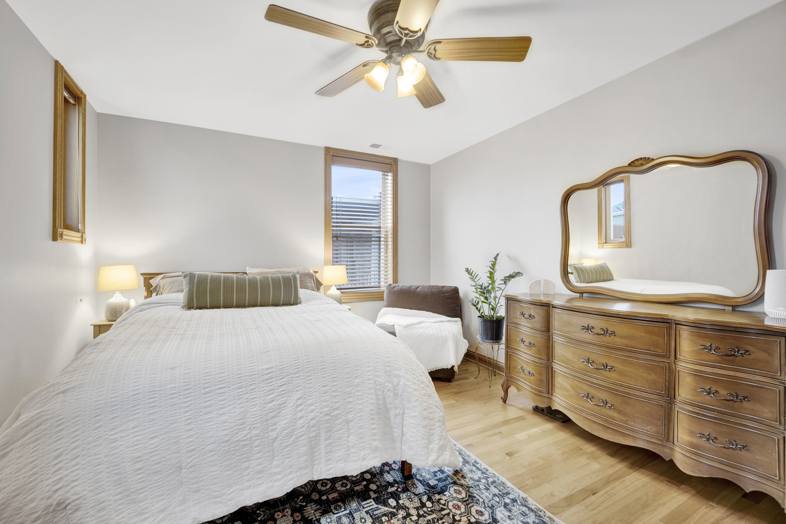 839 South Laflin Street, Unit 3 Chicago, IL 60607 - Photo 19 of 21 a bedroom with a bed and ceiling fan