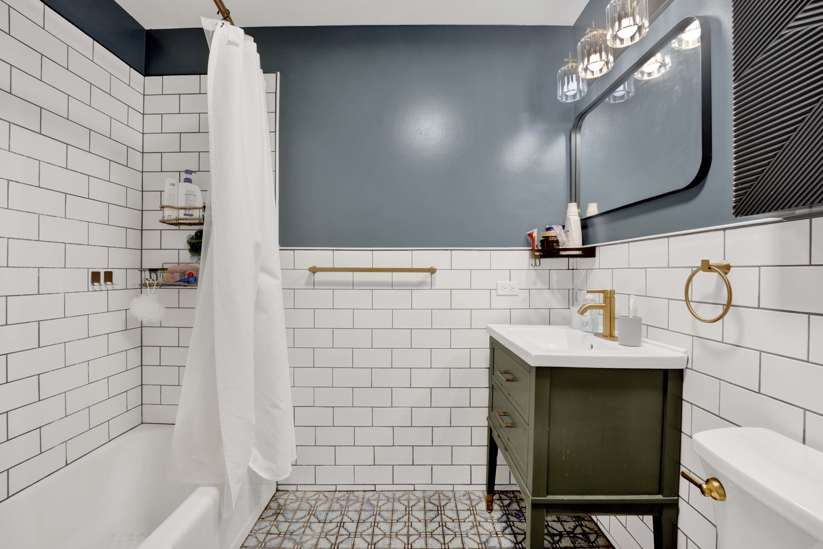 839 South Laflin Street, Unit 3 Chicago, IL 60607 - Photo 6 of 21 a bathroom with a sink a toilet and shower
