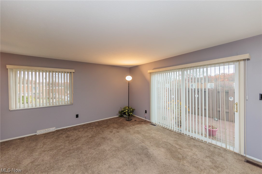 6472 State Road, Unit J19 Parma, OH 44134 - Photo 7 of 33 Carpeted spare room with a wealth of natural light