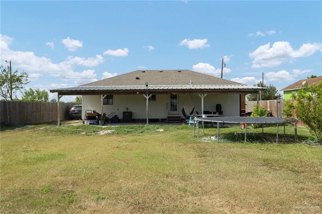 4204 Lott Road Donna, TX 78537 - Photo 11 of 15 a front view of a house with a yard table and chairs