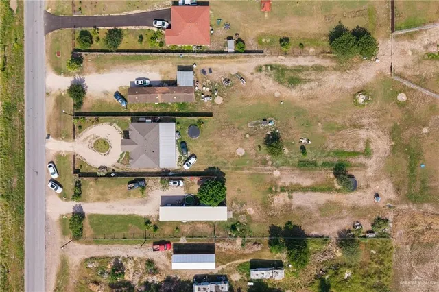 an aerial view of residential houses with outdoor space