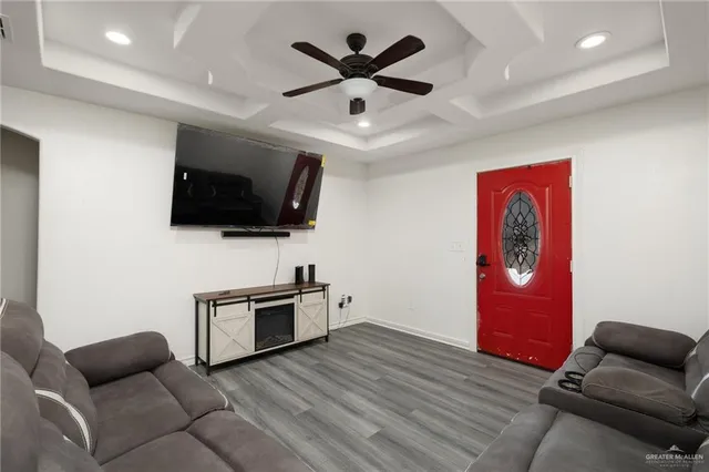 a living room with furniture and a flat screen tv