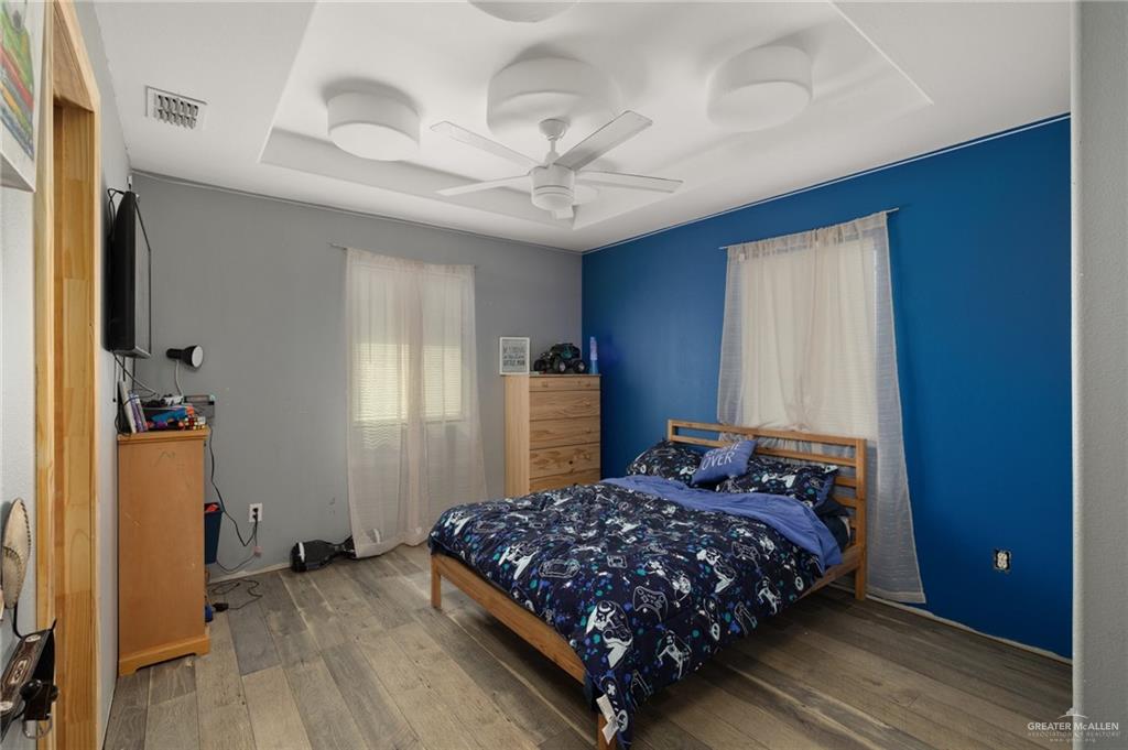 4204 Lott Road Donna, TX 78537 - Photo 7 of 15 a bedroom with a bed dresser and a window