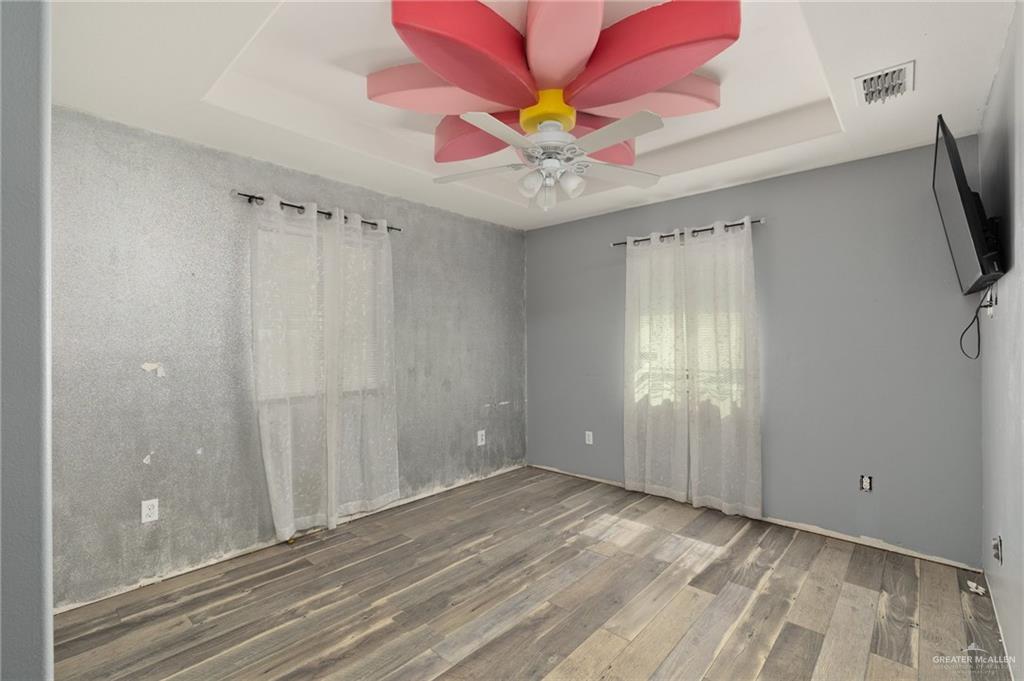 4204 Lott Road Donna, TX 78537 - Photo 8 of 15 wooden floor in an empty room with a window