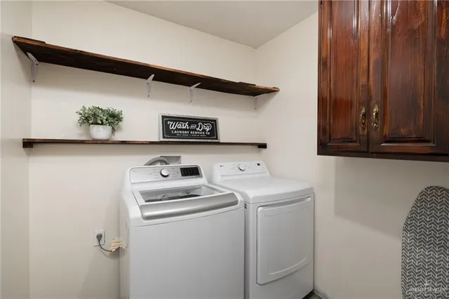 a utility room with dryer and washer