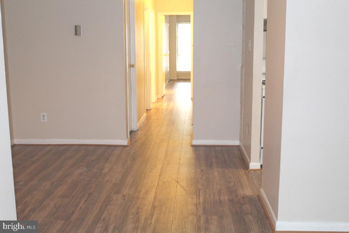 11232 Chestnut Grove Square, Unit 136 Reston, VA 20190 - Photo 14 of 36 Dining Room with a view of hallway to bedrooms