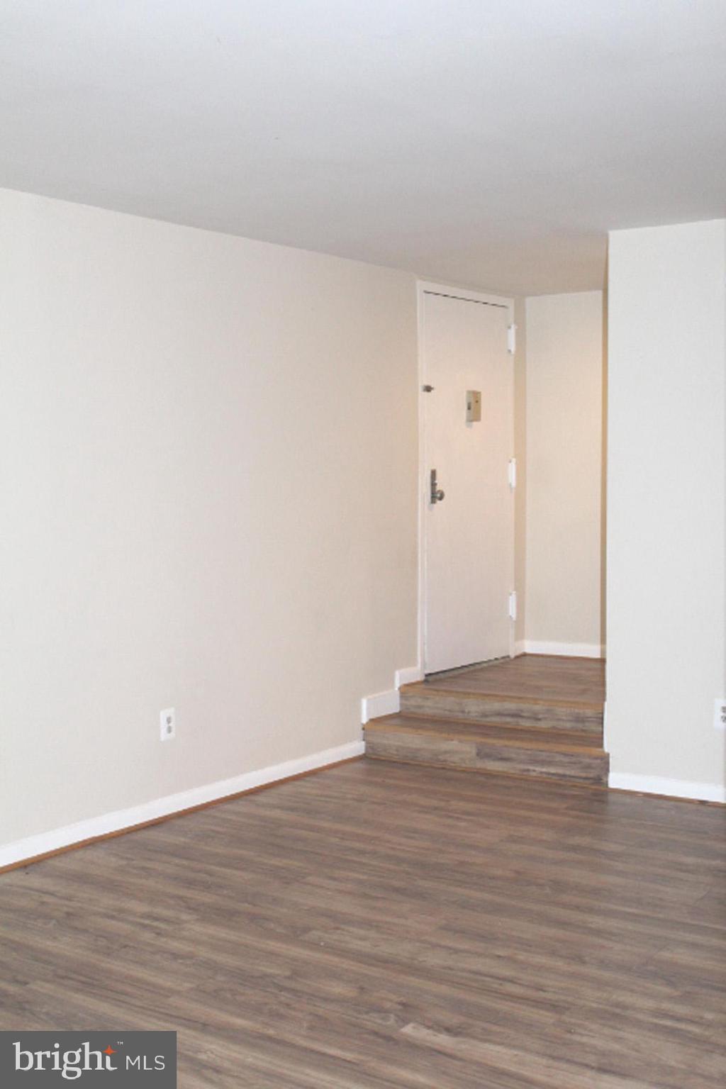 11232 Chestnut Grove Square, Unit 136 Reston, VA 20190 - Photo 18 of 36 View of foyer from living room