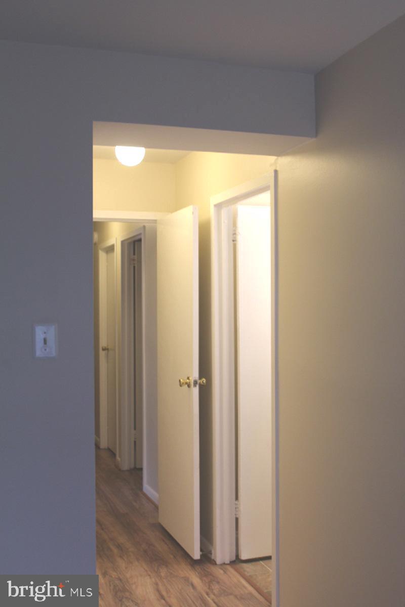 11232 Chestnut Grove Square, Unit 136 Reston, VA 20190 - Photo 24 of 36 Hallway to bedrooms and bath