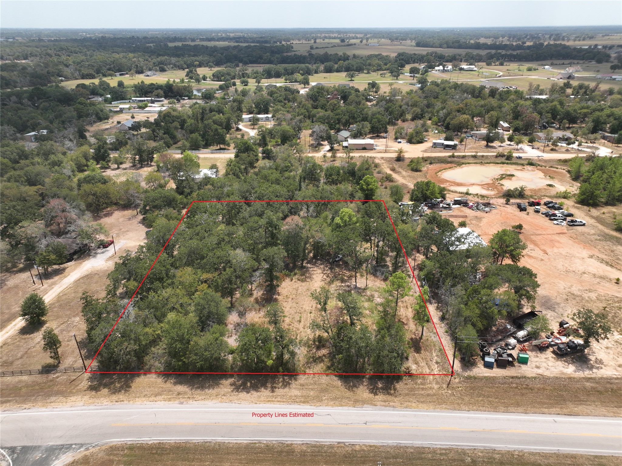 32687 Fm 1736 Road Hempstead, TX 77445 - Photo 2 of 16 an aerial view of residential building and parking space