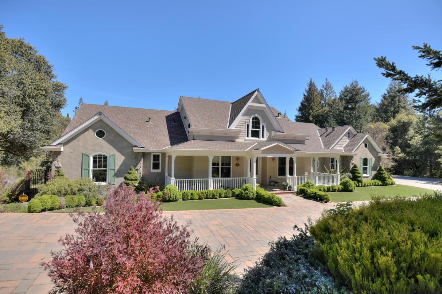 22219 Summit Road Los Gatos, CA 95033 - Photo 1 of 34 a front view of a house with a yard and potted plants