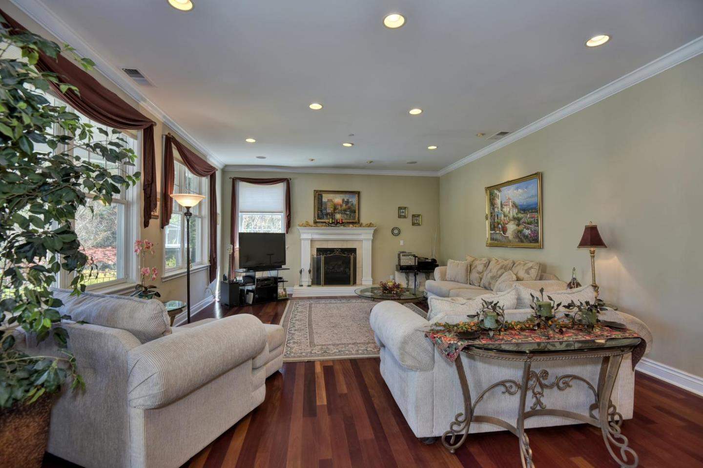 22219 Summit Road Los Gatos, CA 95033 - Photo 12 of 34 a living room with fireplace furniture and a large window