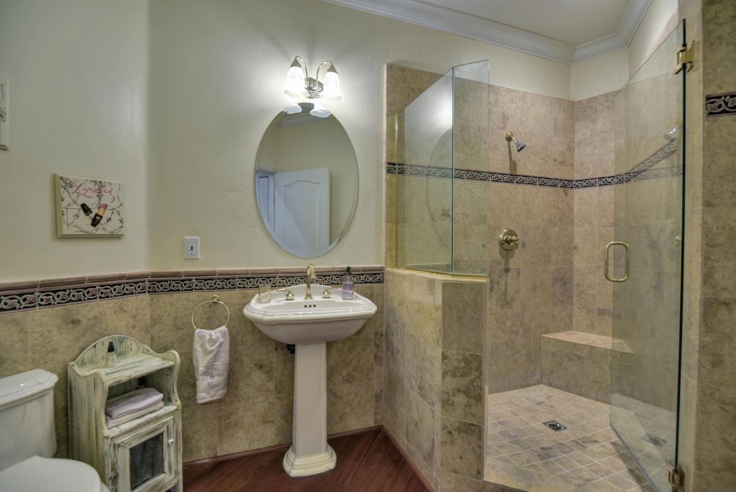 22219 Summit Road Los Gatos, CA 95033 - Photo 14 of 34 a bathroom with a sink mirror toilet and shower