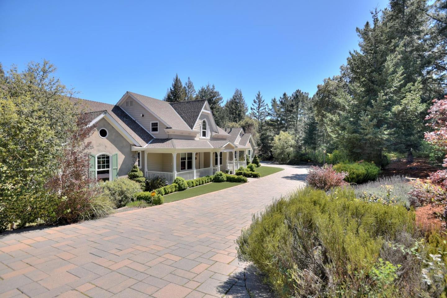 22219 Summit Road Los Gatos, CA 95033 - Photo 2 of 34 a front view of a house with a garden