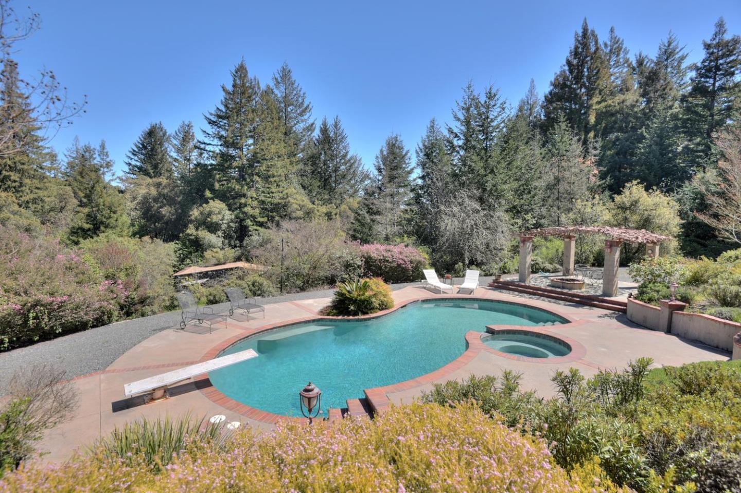 22219 Summit Road Los Gatos, CA 95033 - Photo 25 of 34 a view of a swimming pool and lounge chair