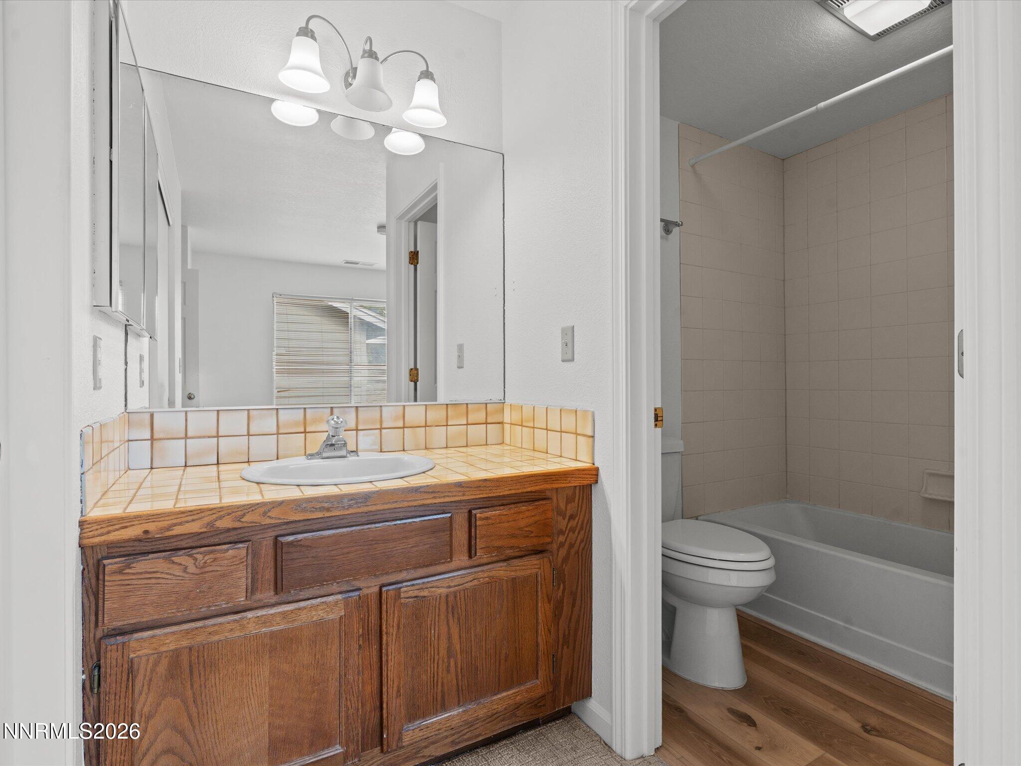 3170 Oakshire Court Reno, NV 89509 - Photo 34 of 43 a bathroom with a sink a toilet and shower