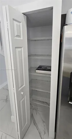 a bathroom with a sink vanity and mirror