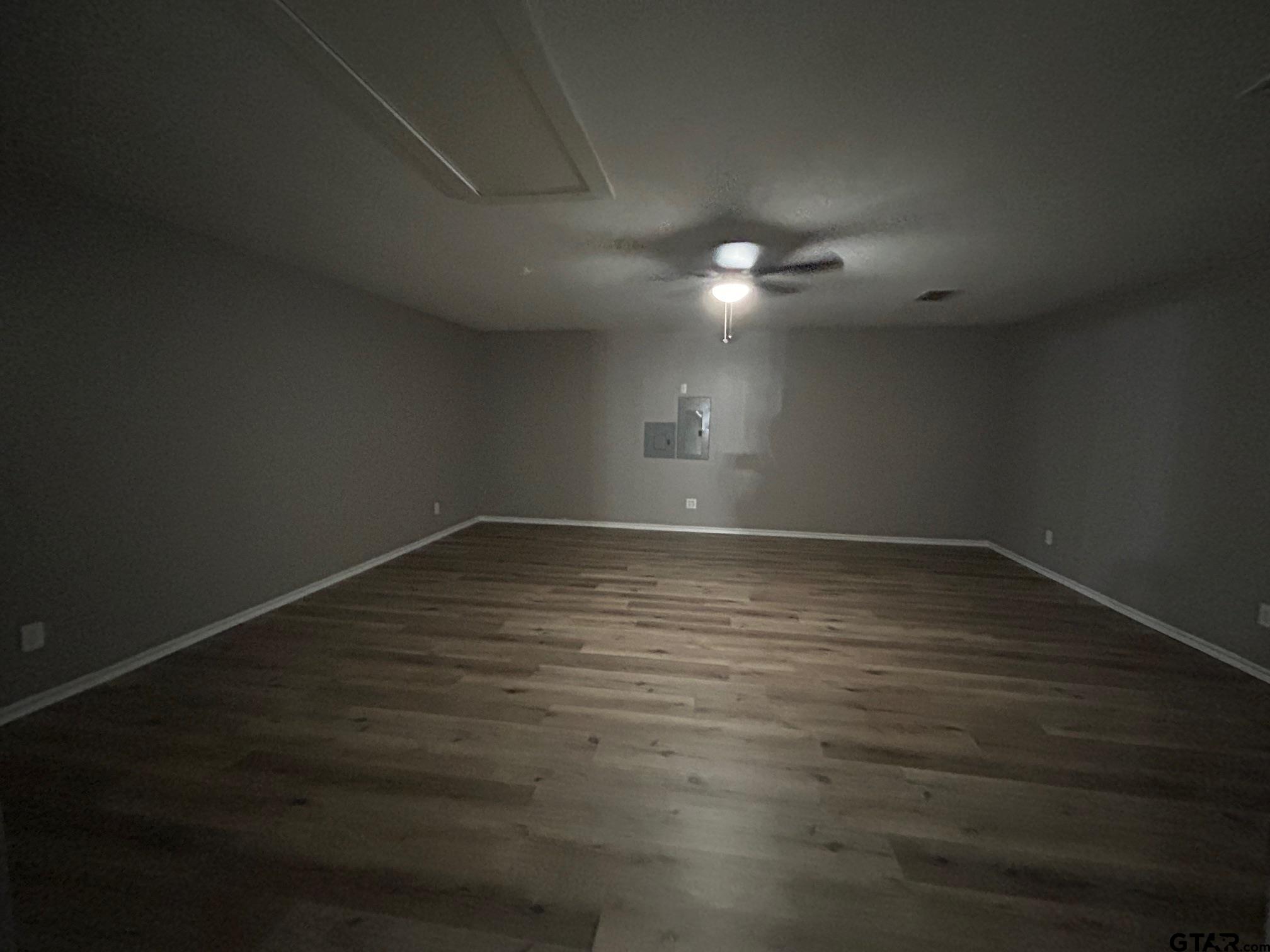 10052 Lakeshore Tyler, TX 75709 - Photo 12 of 28 an empty room with wooden floor and windows