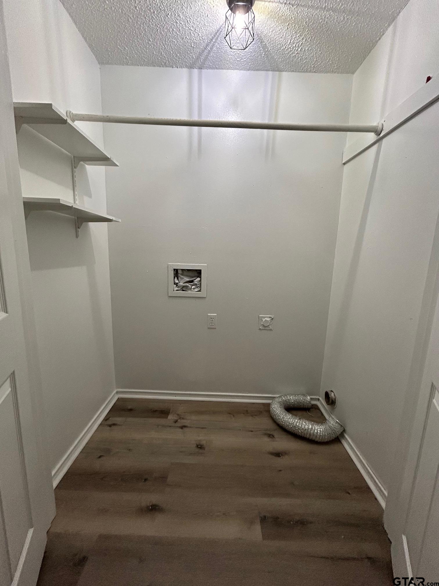 10052 Lakeshore Tyler, TX 75709 - Photo 13 of 28 a view of a room with racks on the wall