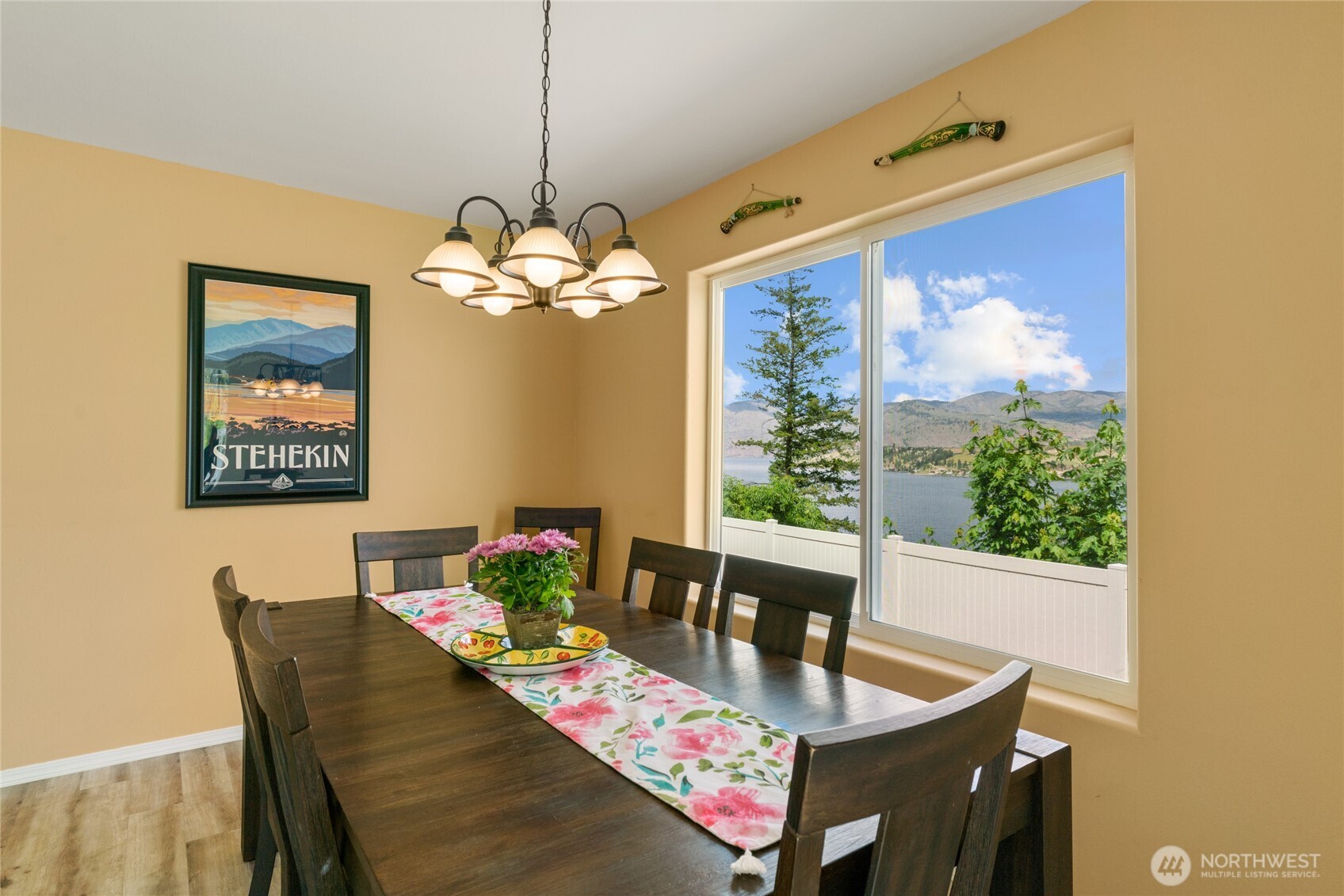 165 Granite Falls Road Chelan, WA 98816 - Photo 20 of 27 a dining room with furniture and a floor to ceiling window