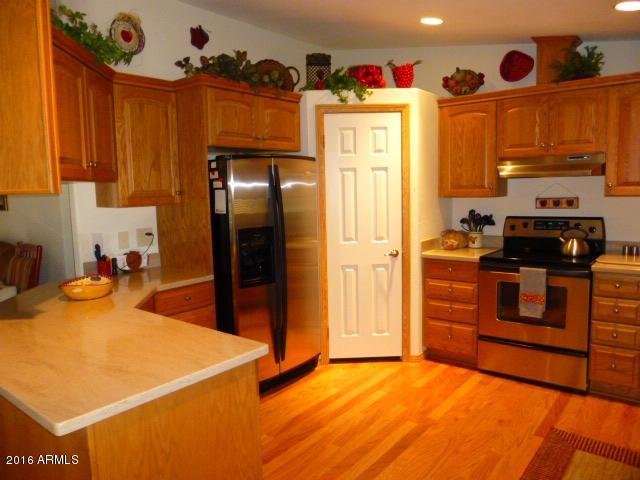 4702 North Razorback Drive Florence, AZ 85132 - Photo 14 of 36 Kitchen Refrig, Pantry Door, Stove
