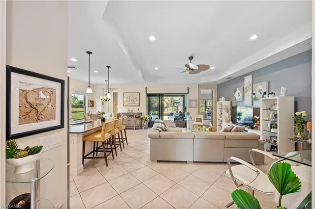 a living room with fireplace furniture and a painting on the wall