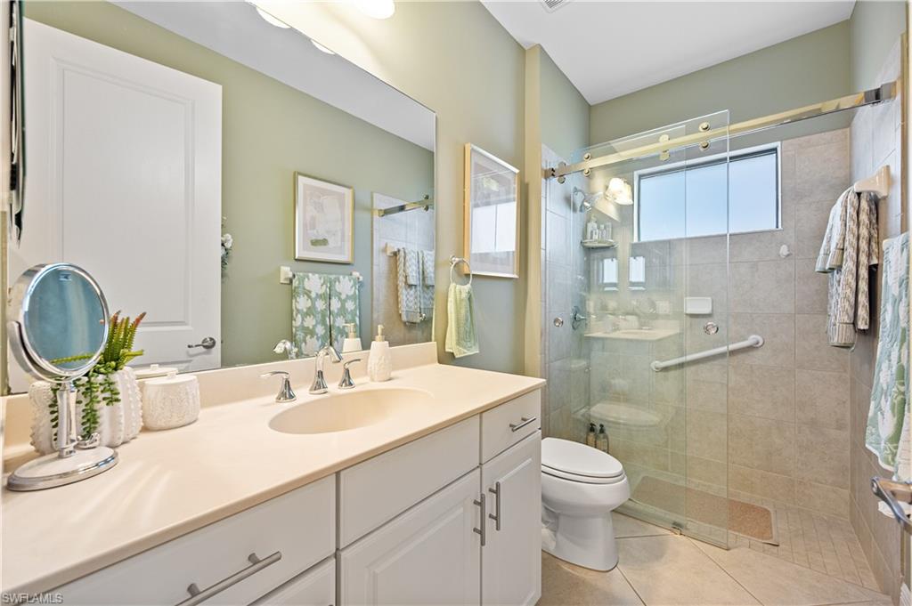 3585 Canopy Circle Naples, FL 34120 - Photo 41 of 46 a bathroom with a sink a toilet and shower