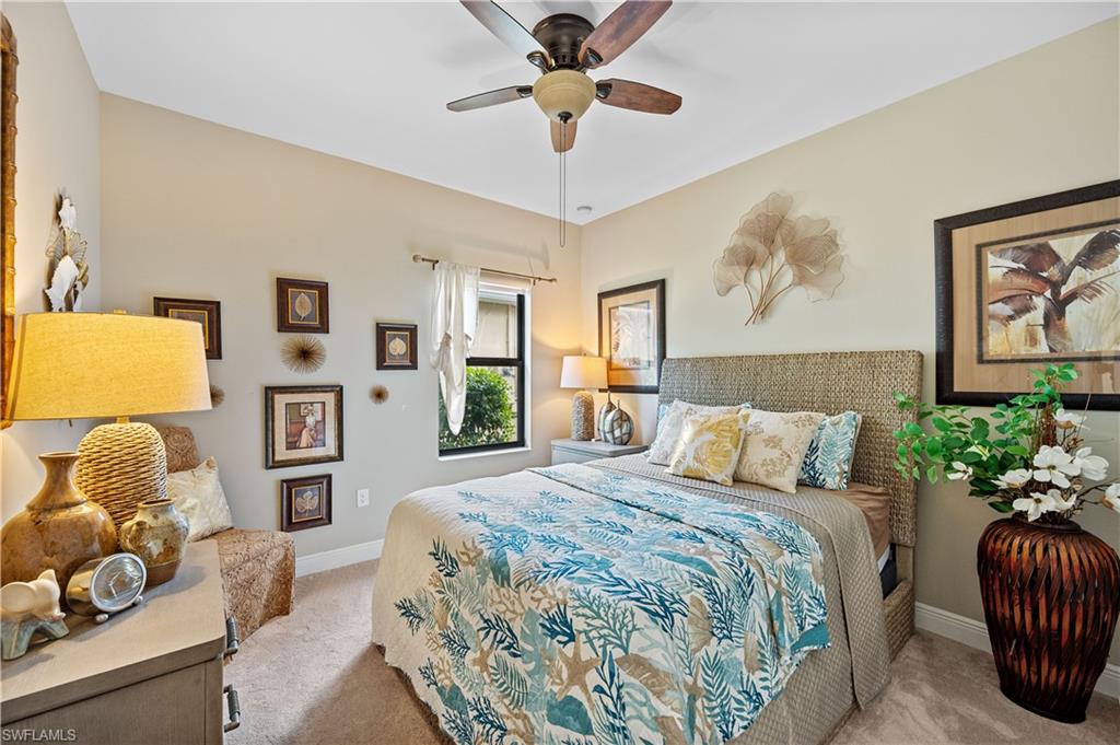 3585 Canopy Circle Naples, FL 34120 - Photo 42 of 46 a bedroom with a bed and window