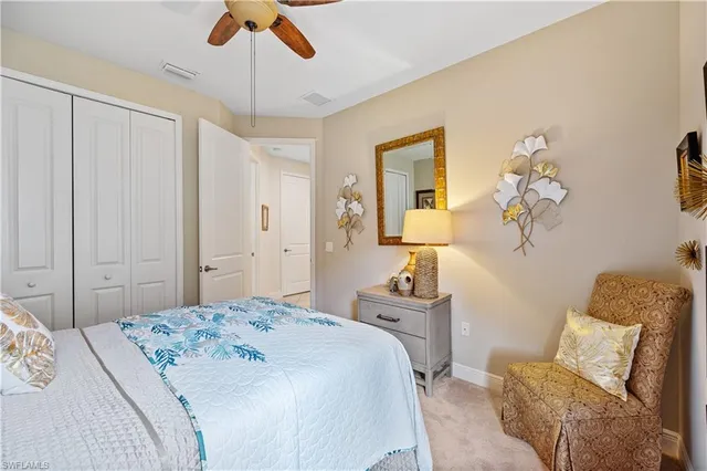 a utility room with dryer washer and a mirror