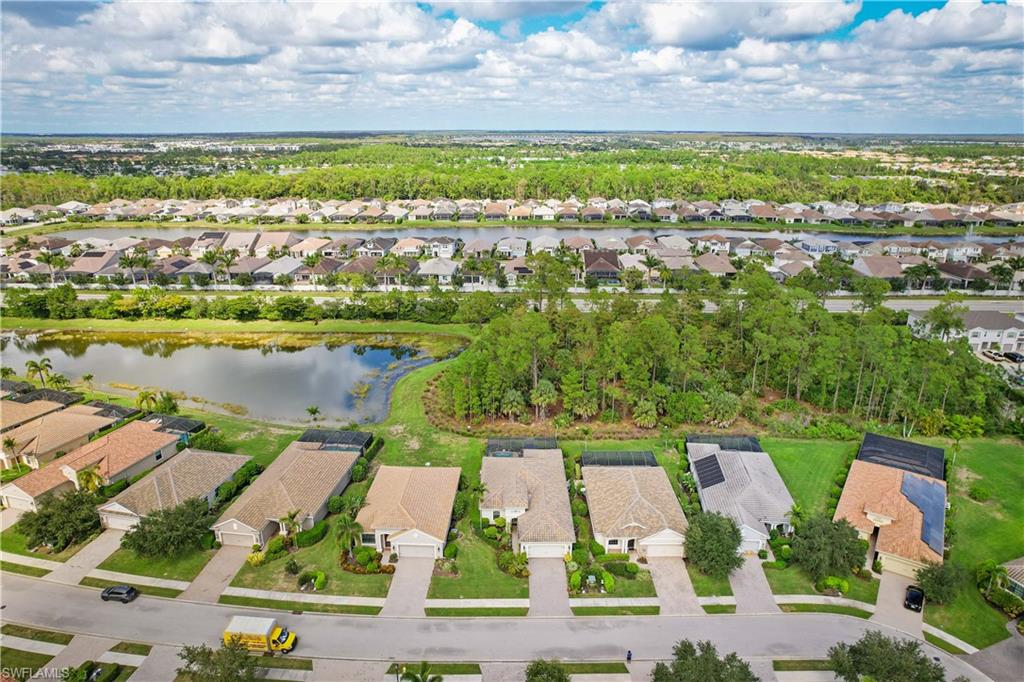 3585 Canopy Circle Naples, FL 34120 - Photo 5 of 46 an aerial view of residential houses with outdoor space and river