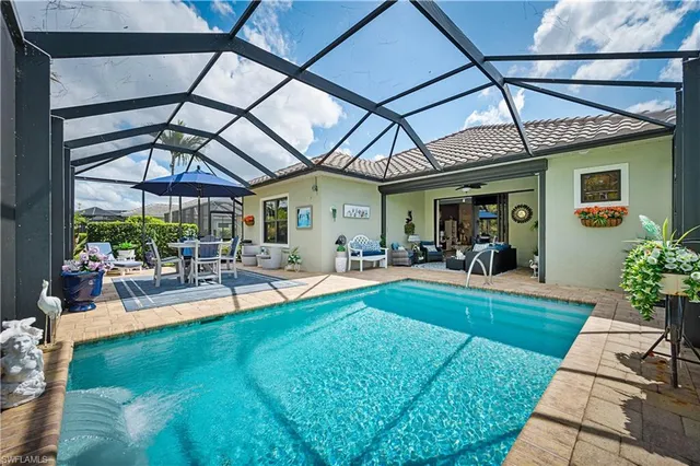 a view of a swimming pool with a patio