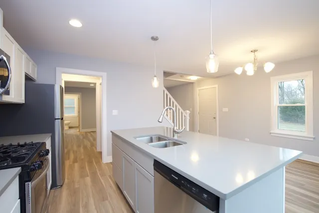 a bathroom with a sink a vanity and a mirror