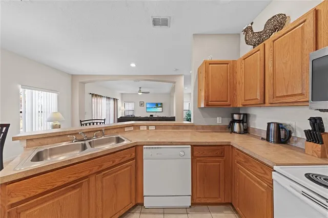 a bathroom with a sink a mirror and a shower