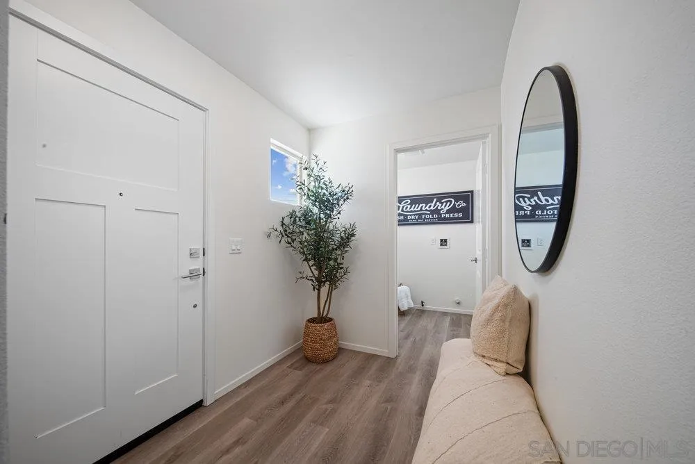 8186 Golden Avenue Lemon Grove, CA 91945 - Photo 4 of 50 a view of a hallway with paintings on the wall