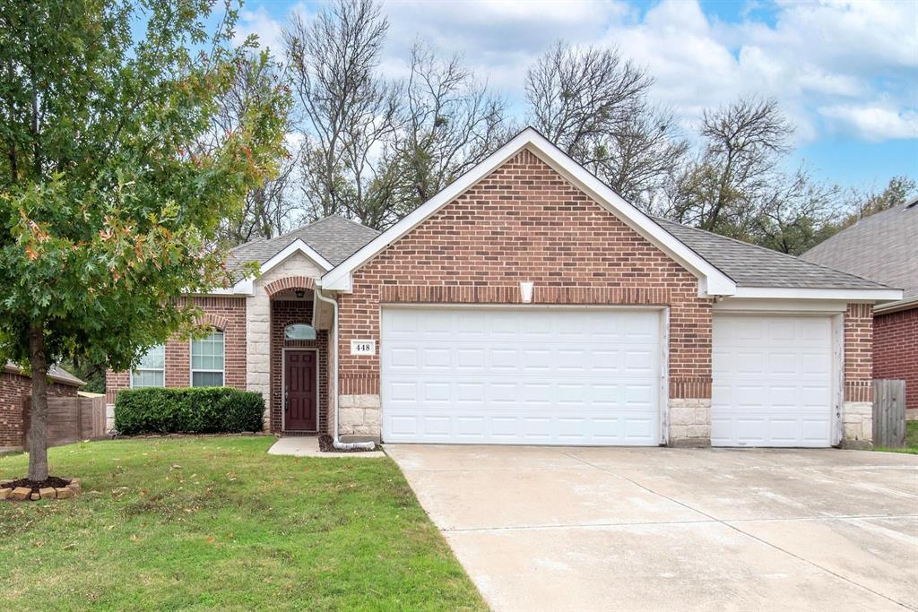 448 Northbrook Avenue Oak Point, TX 75068 - Photo 1 of 12 a front view of a house with a yard and garage