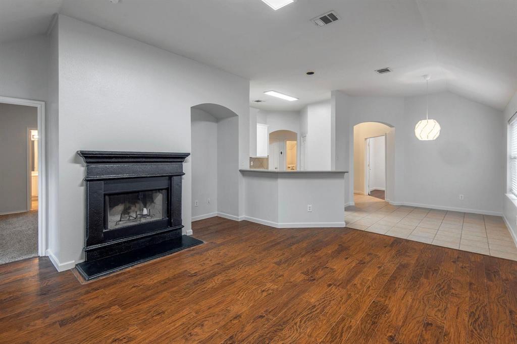 448 Northbrook Avenue Oak Point, TX 75068 - Photo 2 of 12 a view of a kitchen with a sink and a fireplace