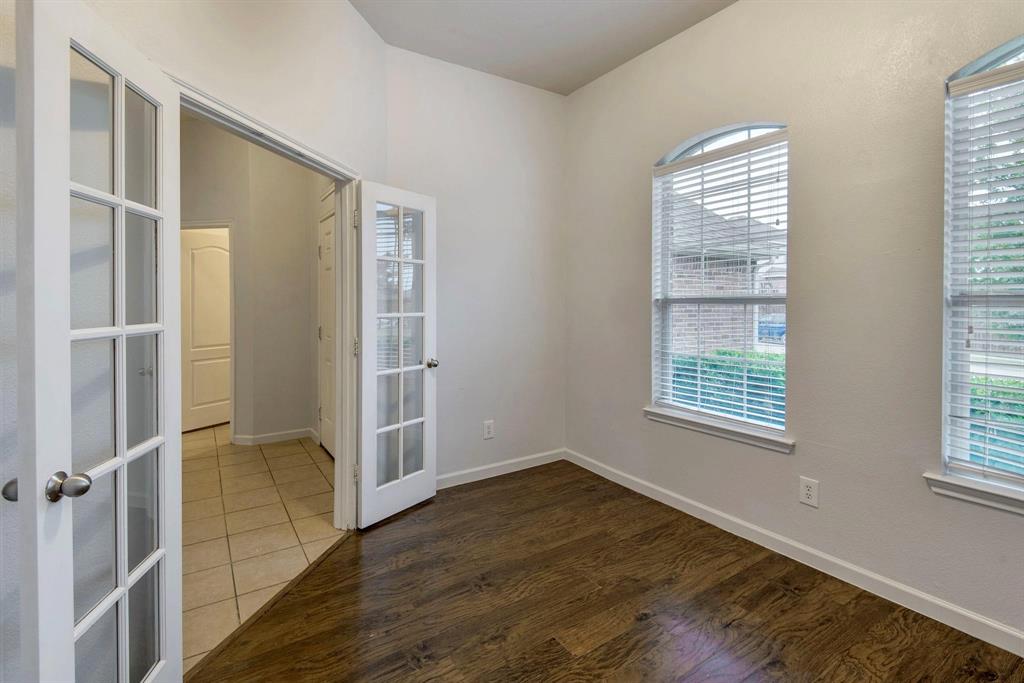 448 Northbrook Avenue Oak Point, TX 75068 - Photo 3 of 12 an empty room with wooden floor and windows