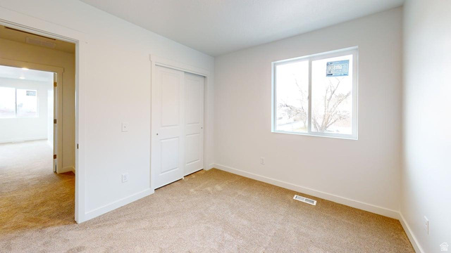 783 Pheasantbrook Drive, Unit 2A Centerville, UT 84014 - Photo 19 of 41 Neutral tone carpet flooring with white baseboards