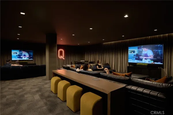 a living room with furniture a rug and a large window