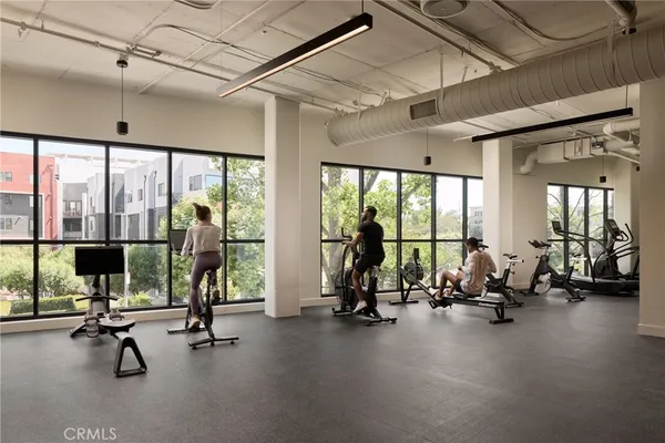 a dining room with furniture and chandelier