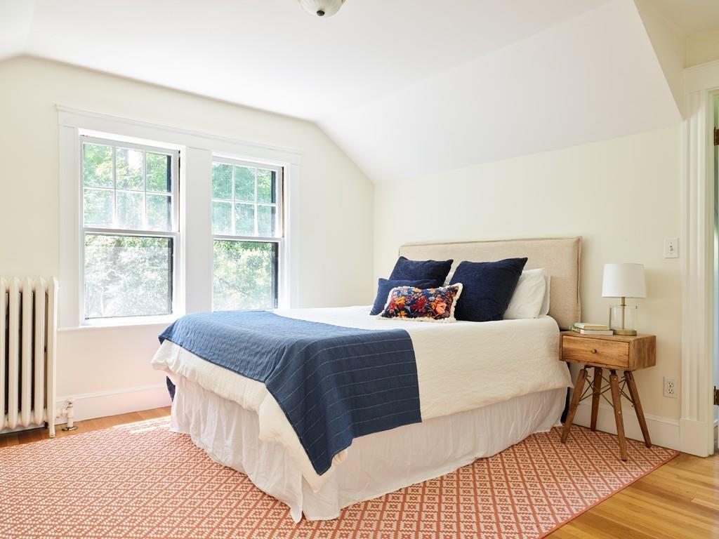 18 Bonad Road Arlington, MA 02476 - Photo 12 of 23 a bedroom with a bed and wooden floor